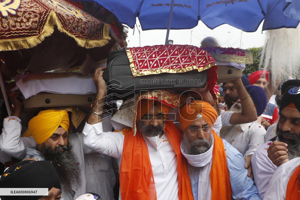 Sikh's Members Carry 3 Saroops Of Sri Guru Granth Sahibat At Airport - Delhi