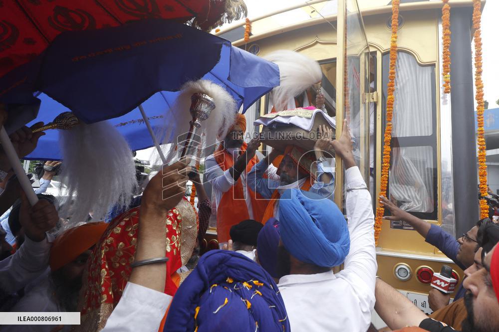 Sikh's Members Carry 3 Saroops Of Sri Guru Granth Sahibat At Airport - Delhi