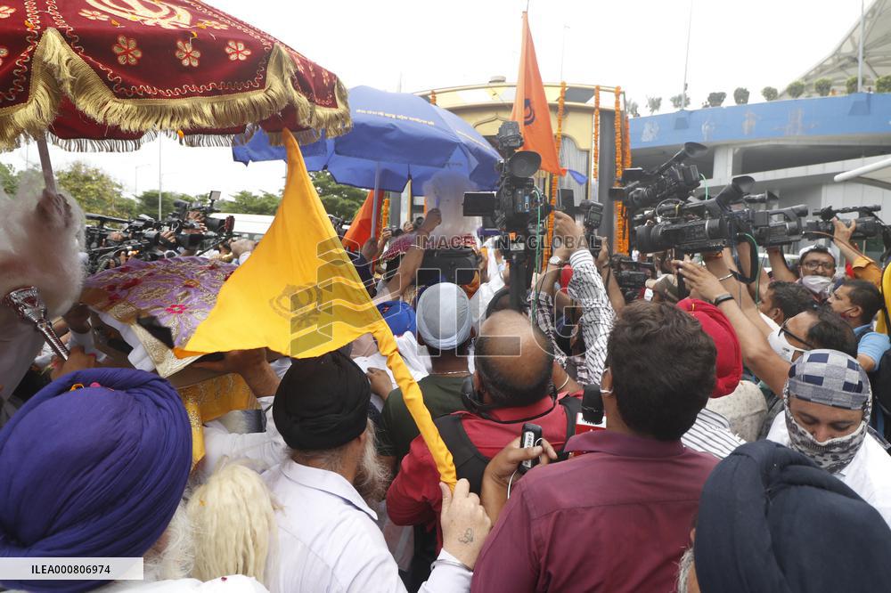 Sikh's Members Carry 3 Saroops Of Sri Guru Granth Sahibat At Airport - Delhi