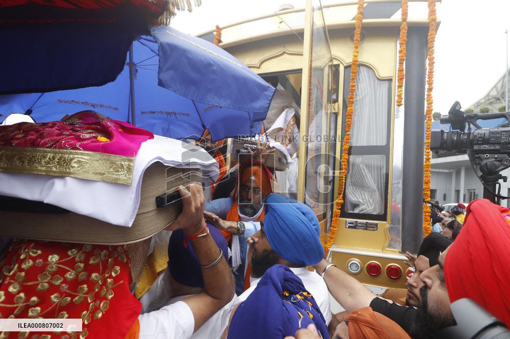 Sikh's Members Carry 3 Saroops Of Sri Guru Granth Sahibat At Airport - Delhi