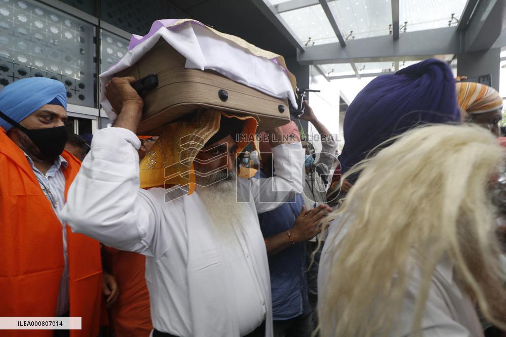 Sikh's Members Carry 3 Saroops Of Sri Guru Granth Sahibat At Airport - Delhi