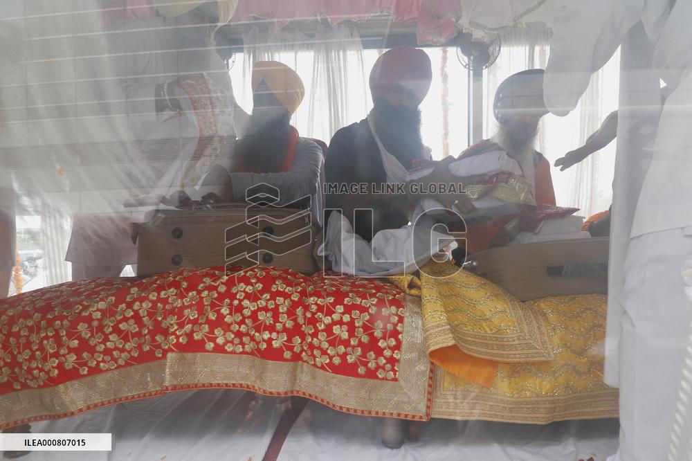 Sikh's Members Carry 3 Saroops Of Sri Guru Granth Sahibat At Airport - Delhi