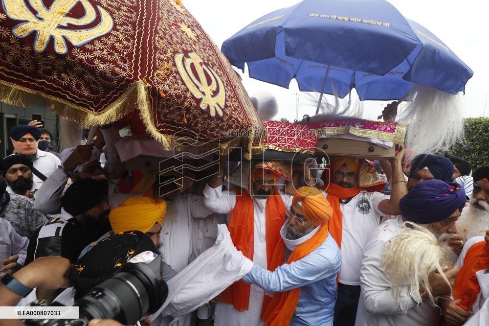 Sikh's Members Carry 3 Saroops Of Sri Guru Granth Sahibat At Airport - Delhi