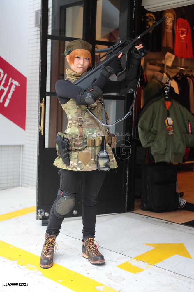 Girls playing an air soft gun (a survival game)