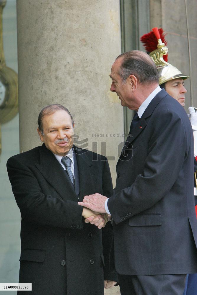 President Jacques Chirac greets his Algerian counterpart Abdelaziz Bouteflika at the Elysee Palace