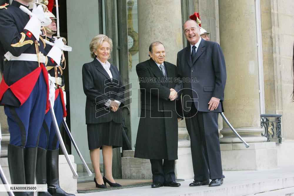 President Jacques Chirac greets his Algerian counterpart Abdelaziz Bouteflika at the Elysee Palace