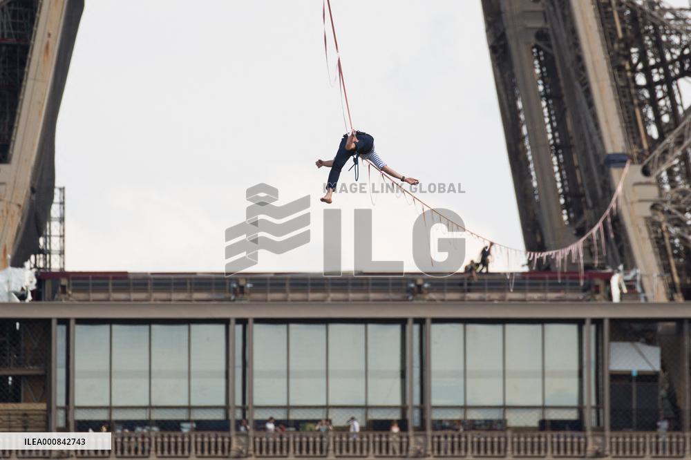 Nathan Paulin Traverses A Slackline Between The Eiffel Tower And The Chaillot Theater