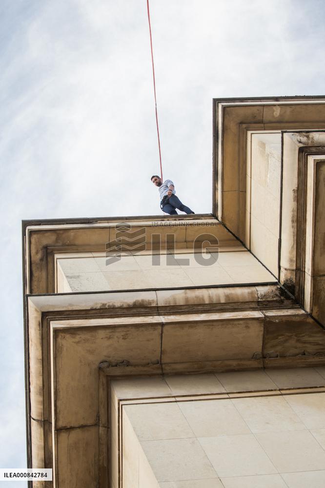 Nathan Paulin Traverses A Slackline Between The Eiffel Tower And The Chaillot Theater