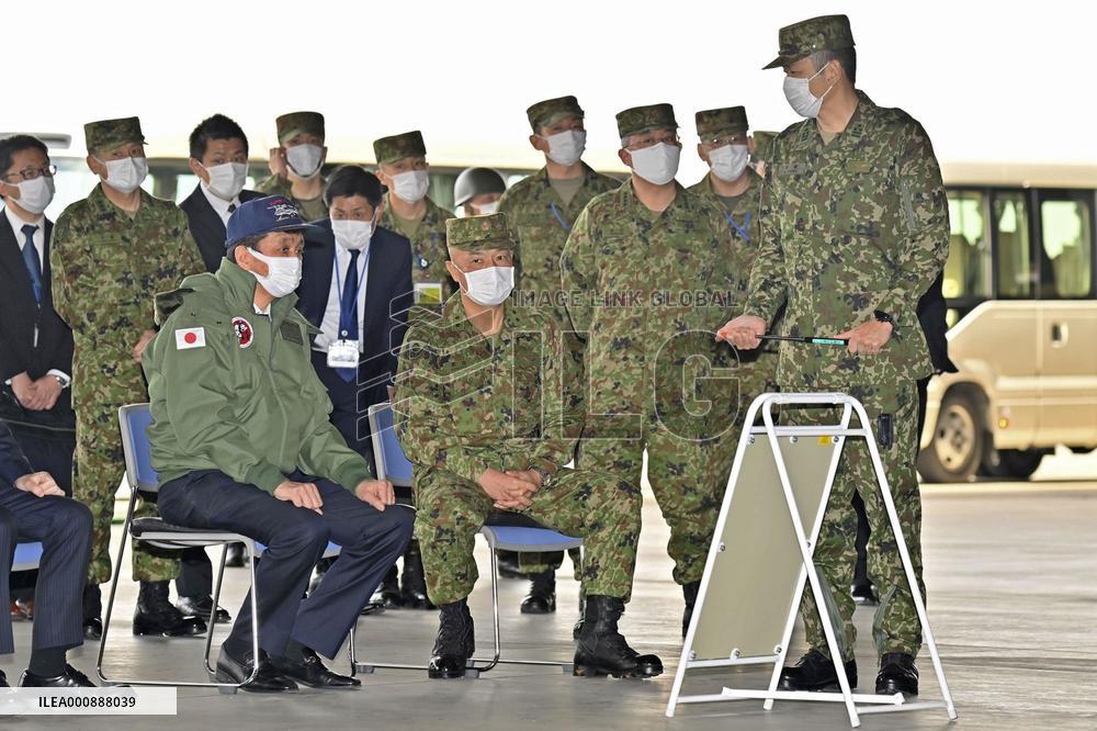 Japan's defense minister boards Osprey