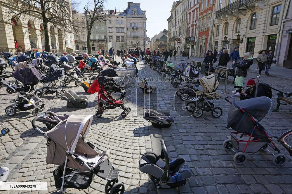 Empty buggies for Ukraine children victims
