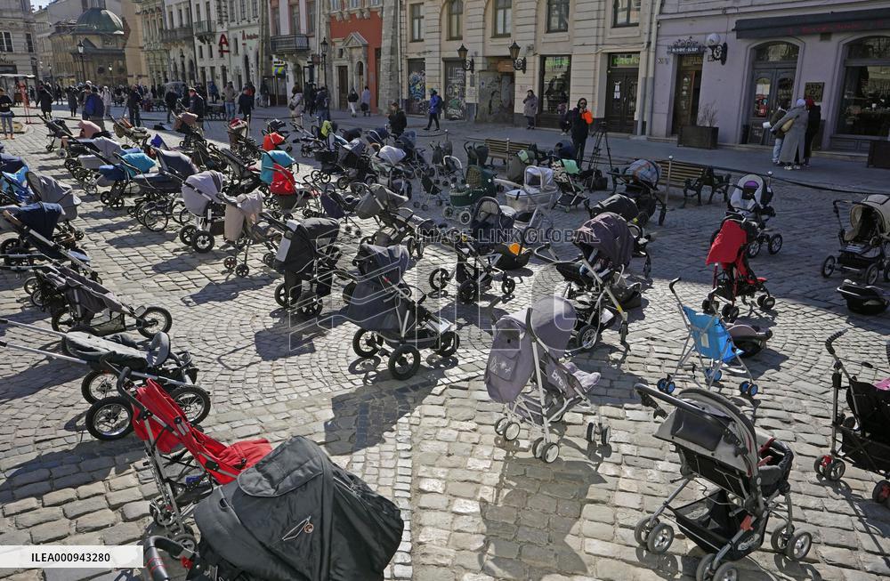 Empty buggies for Ukraine children victims