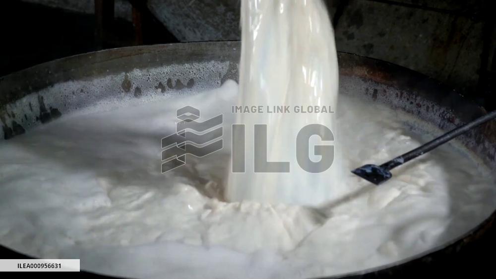Workers in Bangladesh prepare for Bogura yogurt in Ramadan