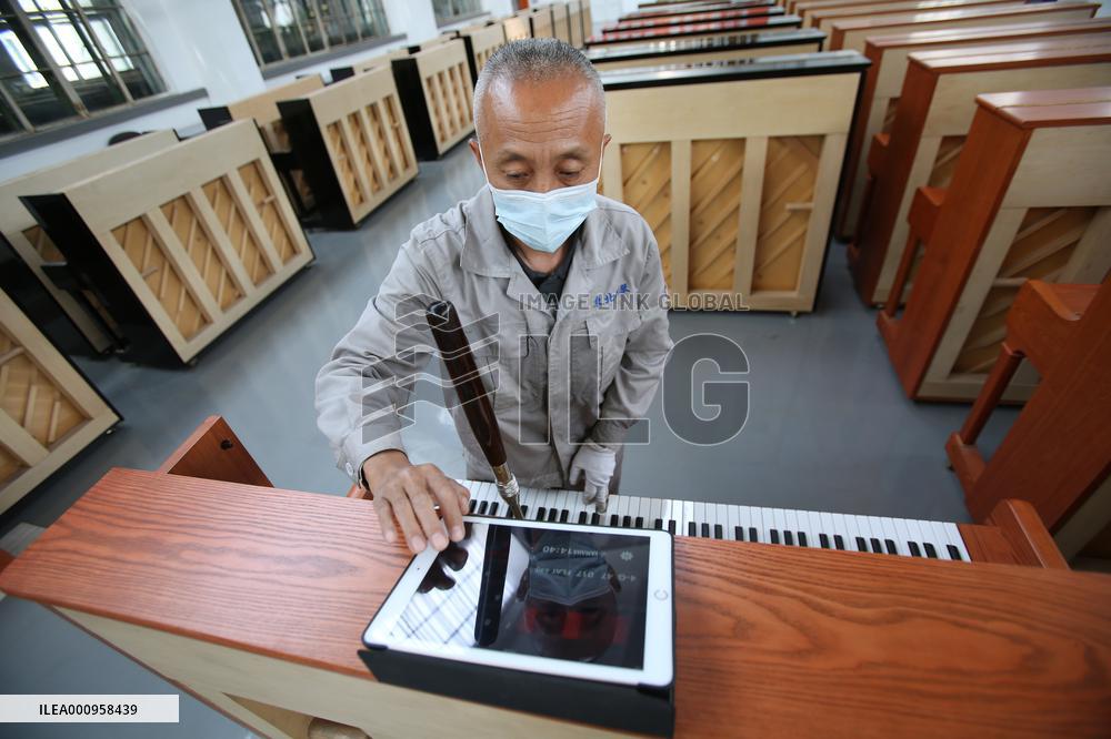 CHINA-LIAONING-YINGKOU-PIANO MAKING-RESUMPTION (CN)