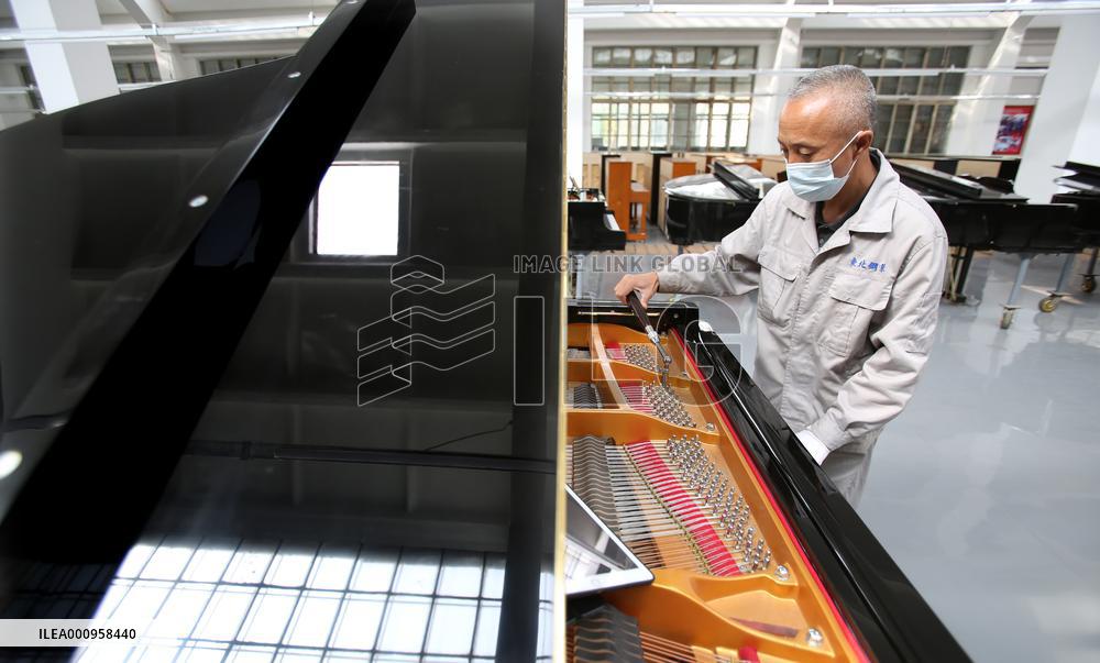 CHINA-LIAONING-YINGKOU-PIANO MAKING-RESUMPTION (CN)