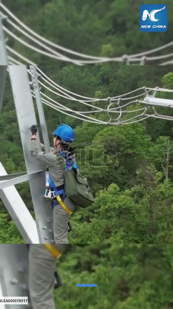 "Spider-Woman" works on "power highway" in China's Hubei