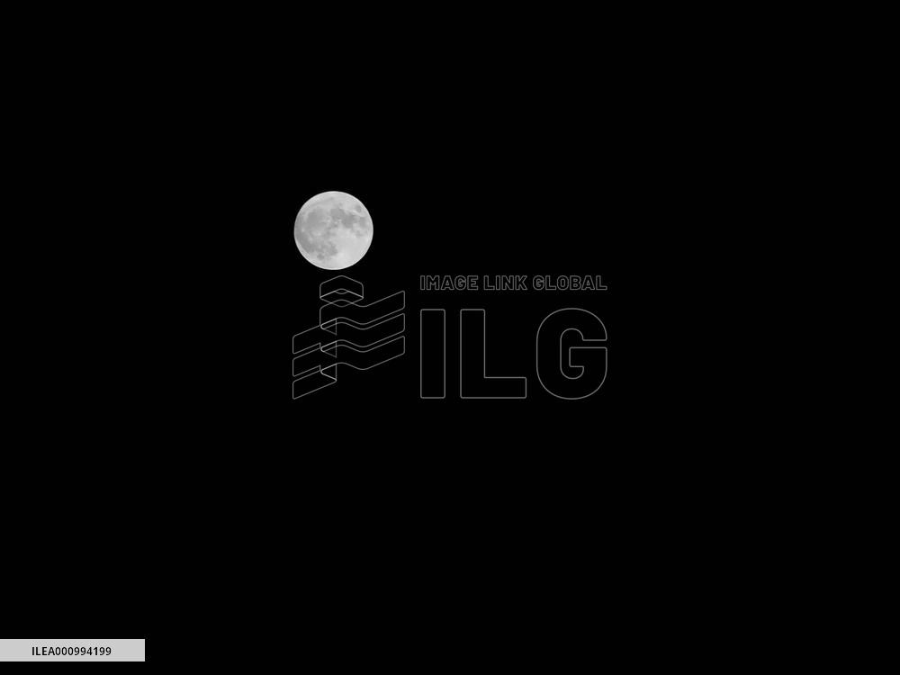 MOBILE PHONE SNAPSHOT-CHINA-BEIJING-MOON