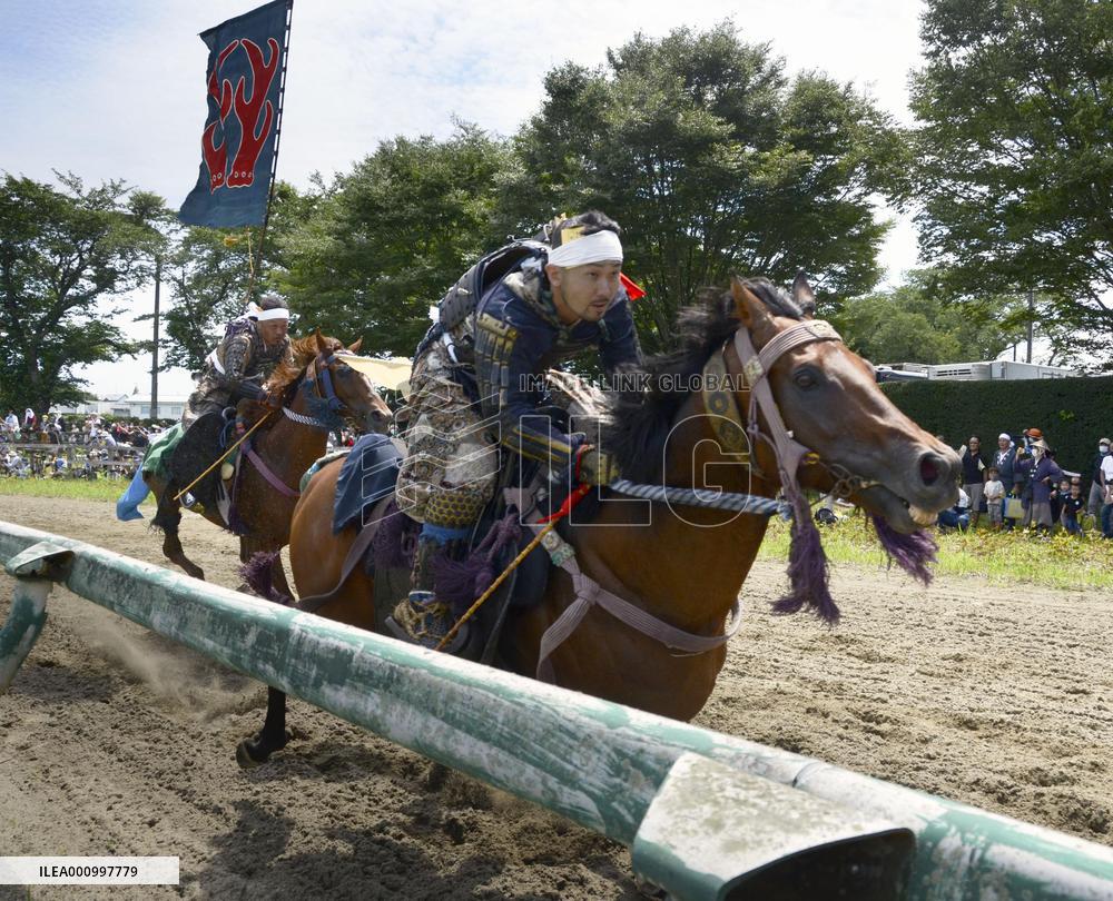 Armored warriors compete in horse race