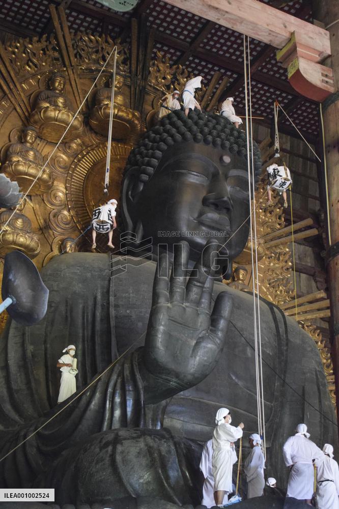 Annual cleaning of Great Buddha of Nara