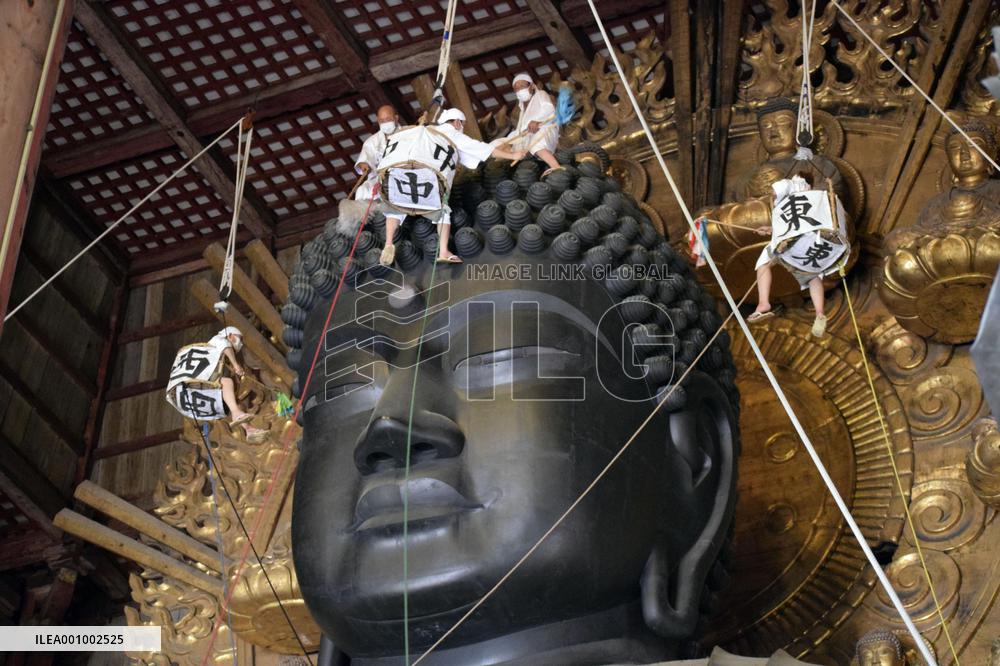 Annual cleaning of Great Buddha of Nara