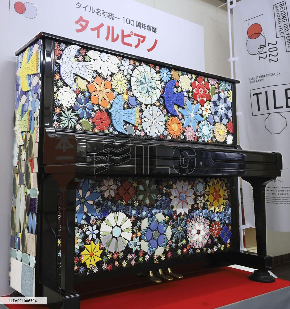 Piano decorated with ceramic ware tiles