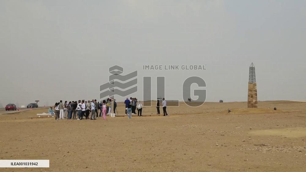 Contemporary art exhibition held in front of Egyptian pyramids