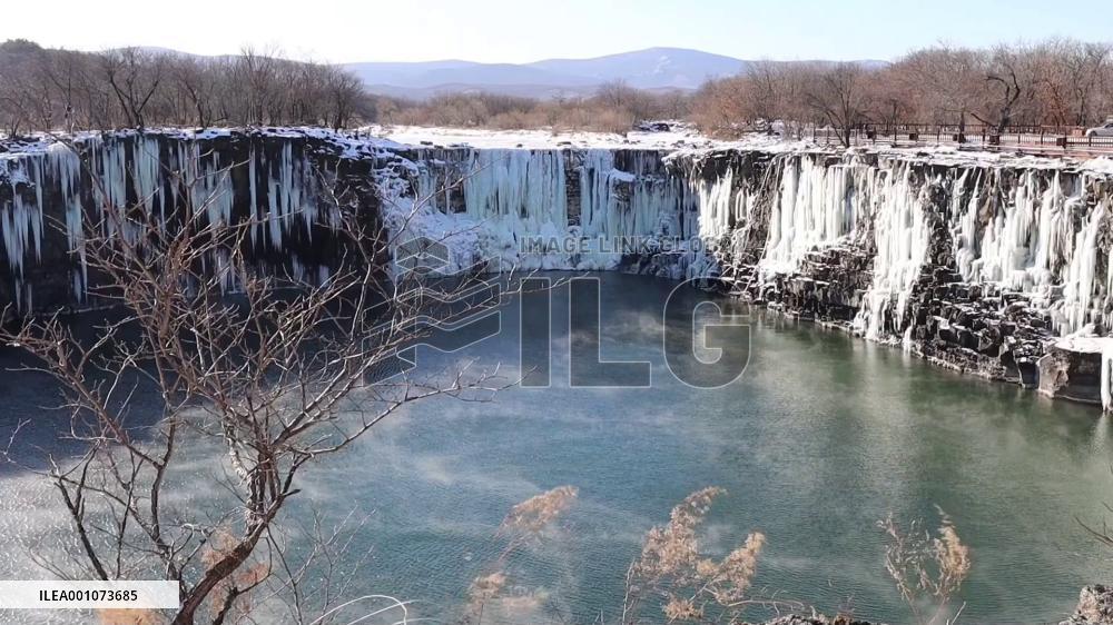 Spectacular views of frozen waterfall at China's Jingpo Lake