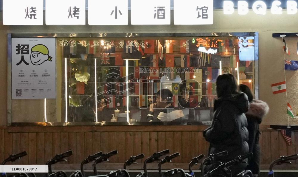 Beijing eases COVID curbs