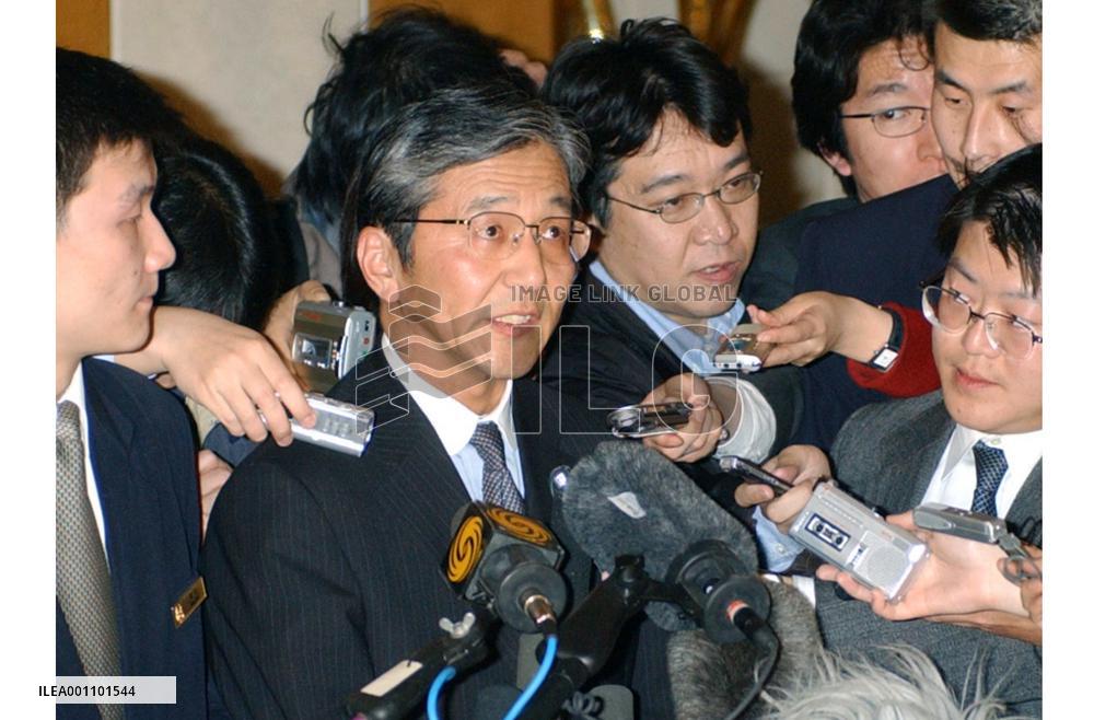Yabunaka talks to reporters