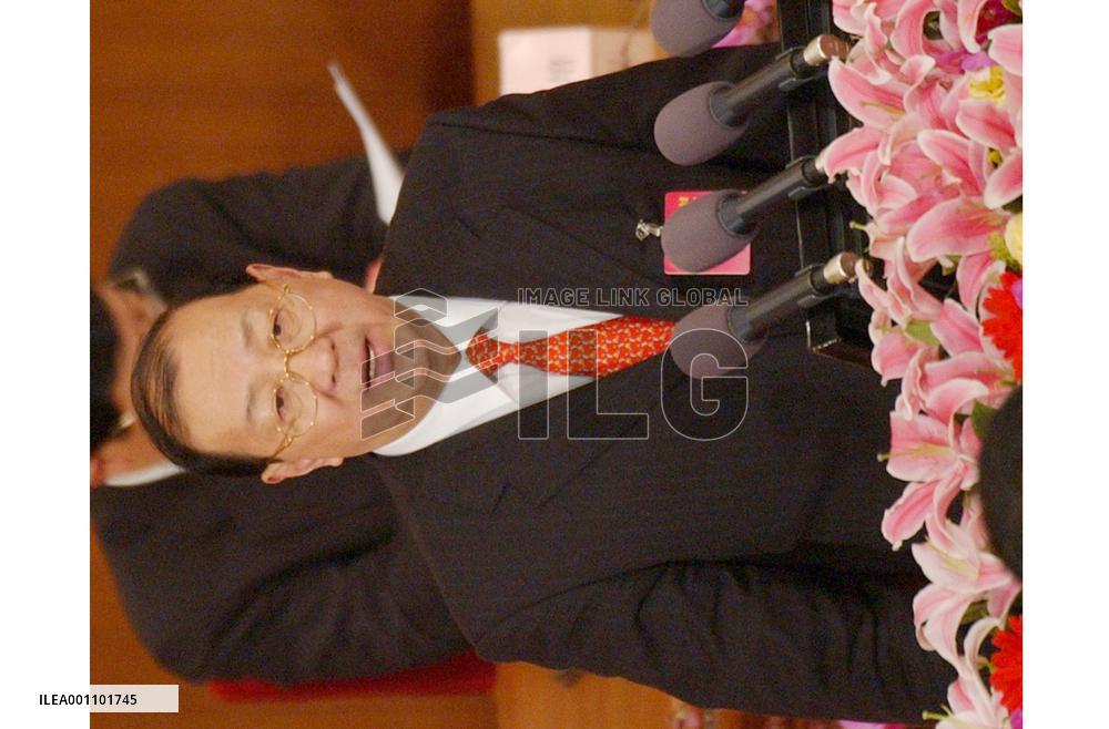 Chinese budget pledges more to farmers, military