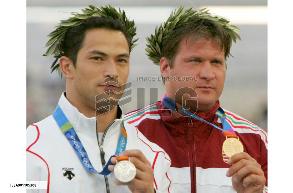 Hammer throw winner stripped of gold, Murofushi given gold