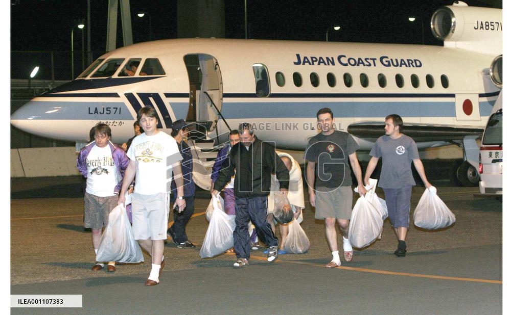 16 freighter crew members rescued, 6 missing