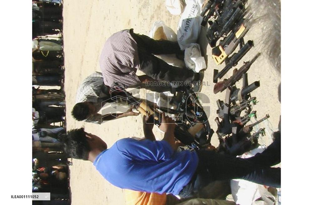 Rebels in Indonesia's Aceh begin to disarm, hand over weapons