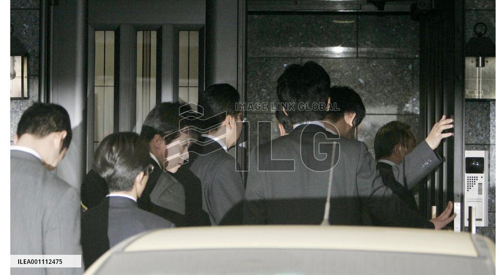 Police raid 117 locations over building scandal