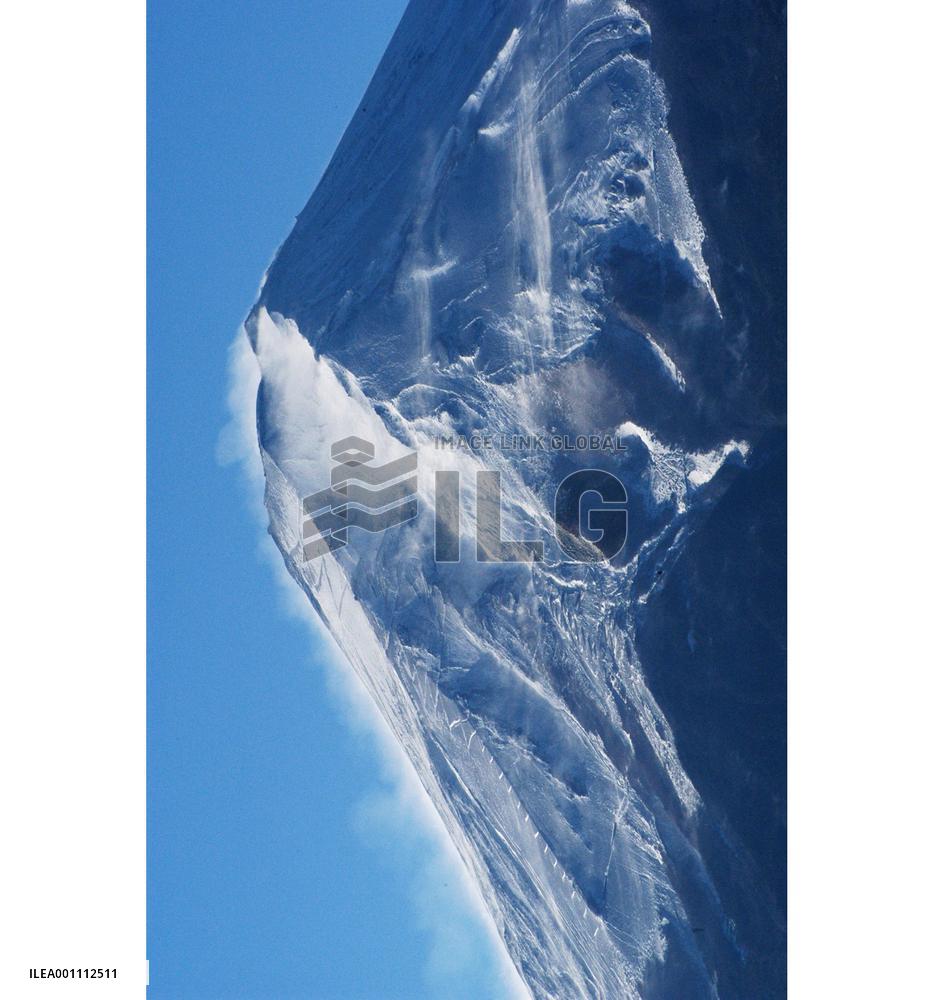 Strong winds blow snow from top of Mt. Fuji
