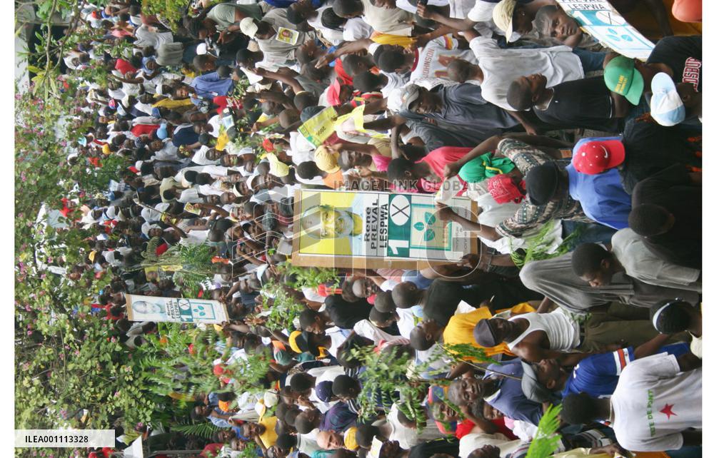 Supporters of Rene Preval march in Port-au-Prince