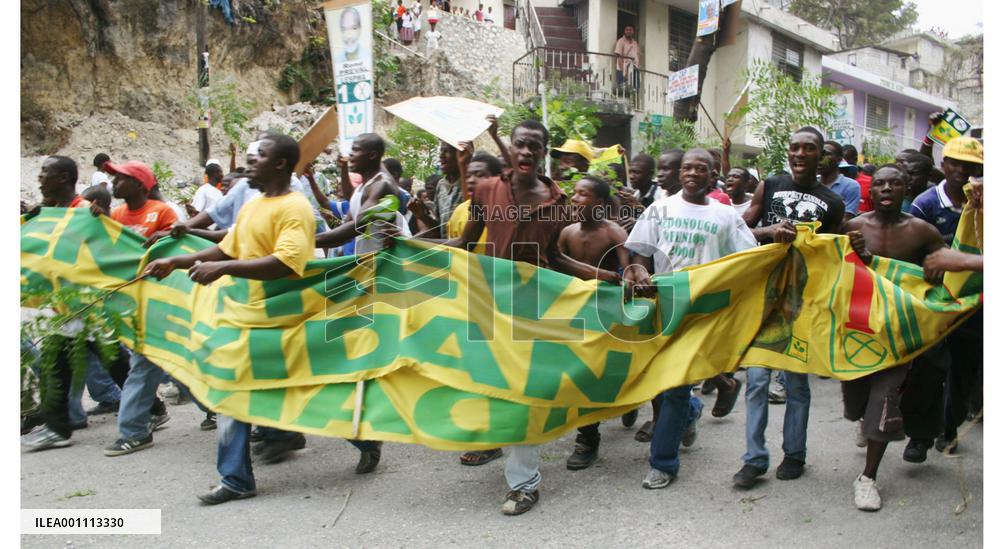Supporters of Rene Preval march in Port-au-Prince