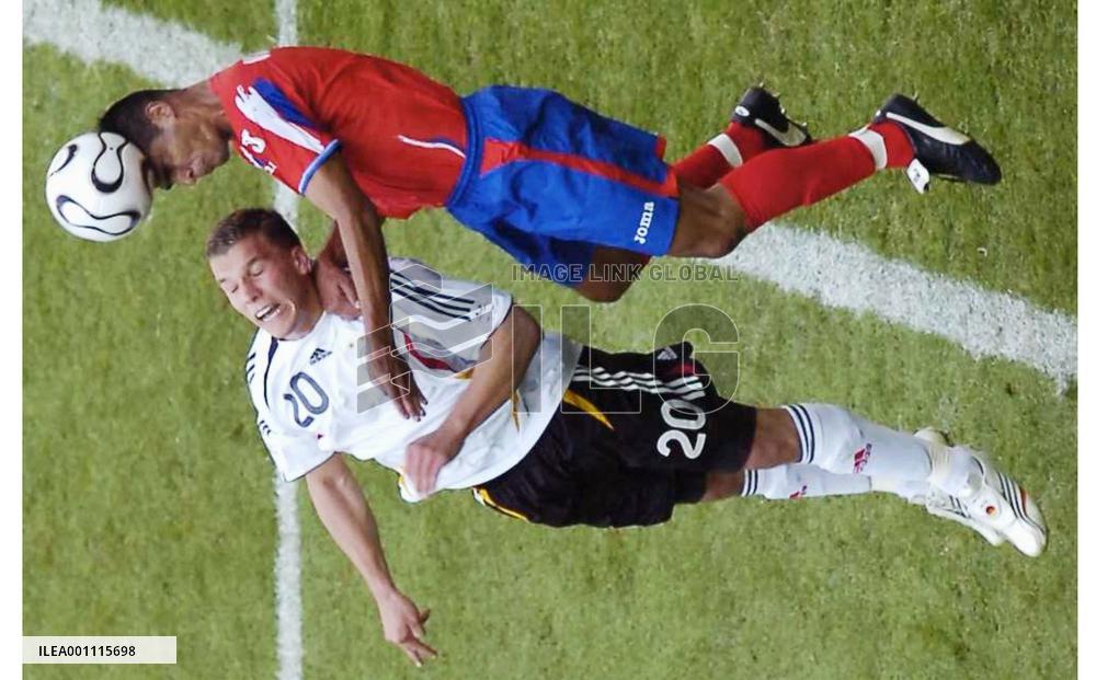 Podolski fighting for the ball