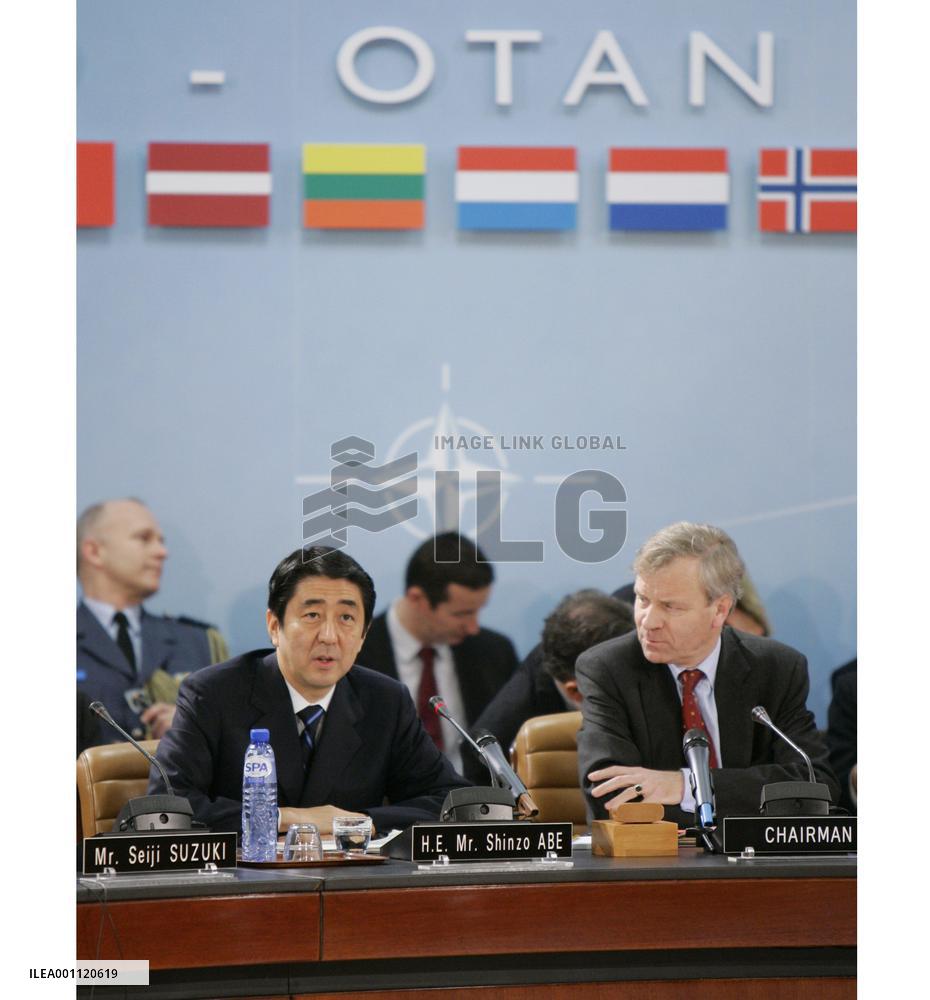 Abe tells NATO Japan won't shy from sending troops for int'l peace