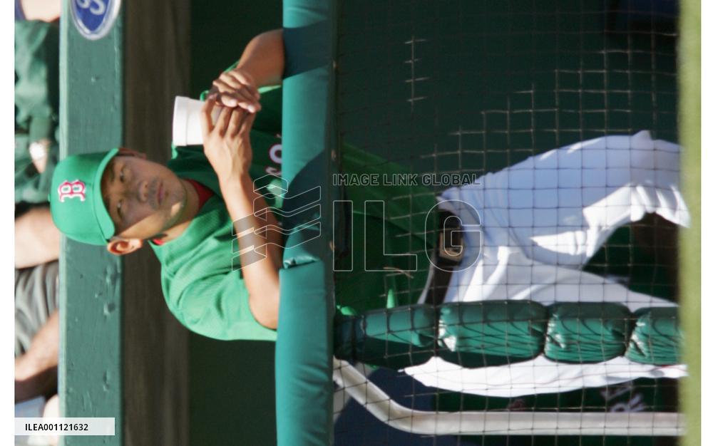 Matsuzaka wears green cap, shirt