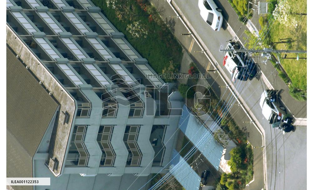 Man locks himself in building in Tokyo suburb, fires outside
