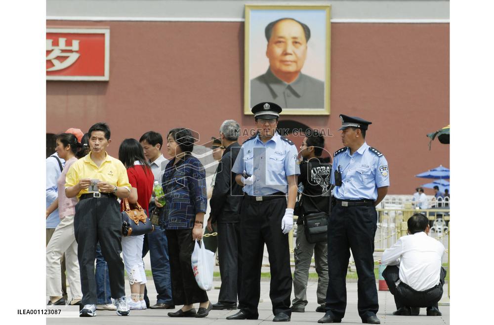 Police keep watch at Tiananmen Square on 18th anniversary