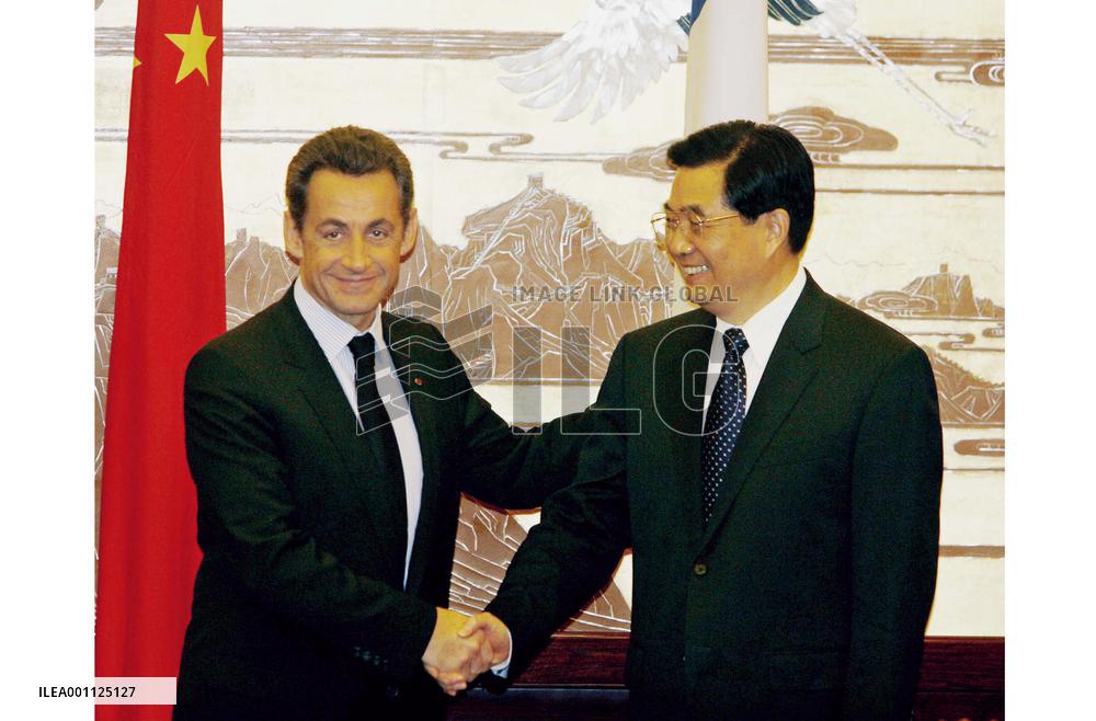 French president urges China to revalue currency