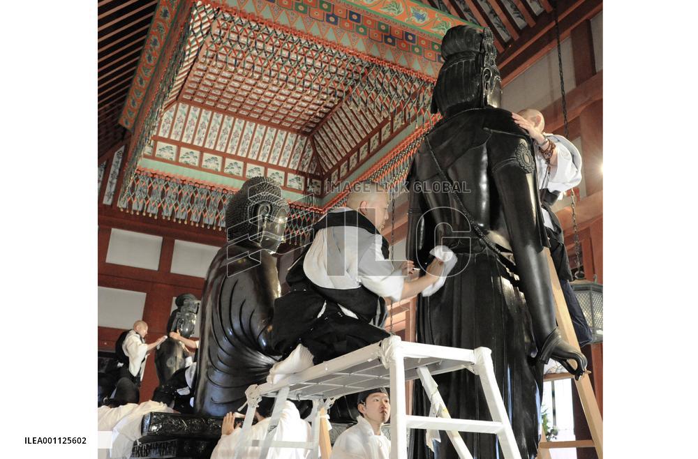 Buddhist statues at Nara temple get New Year's dust-off