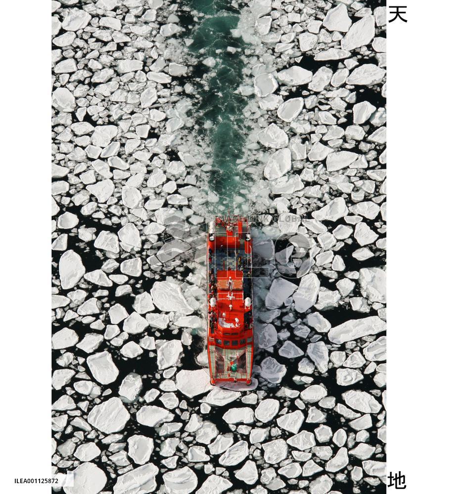 Tourists watch drift ice off Hokkaido