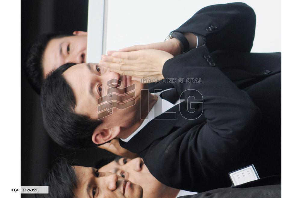 Ousted Thai premier Thaksin returns home to face corruption charges