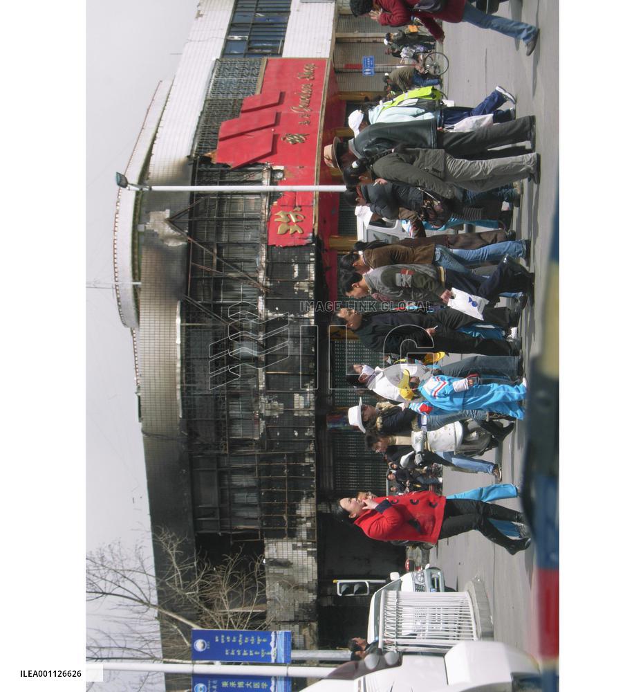 Tibet's capital quiet after riots, armed forces remain in sight