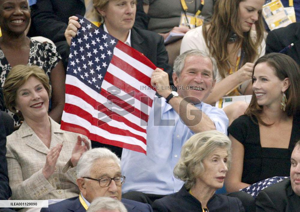 Bush, wife root for American swimmers at Beijing Olympics