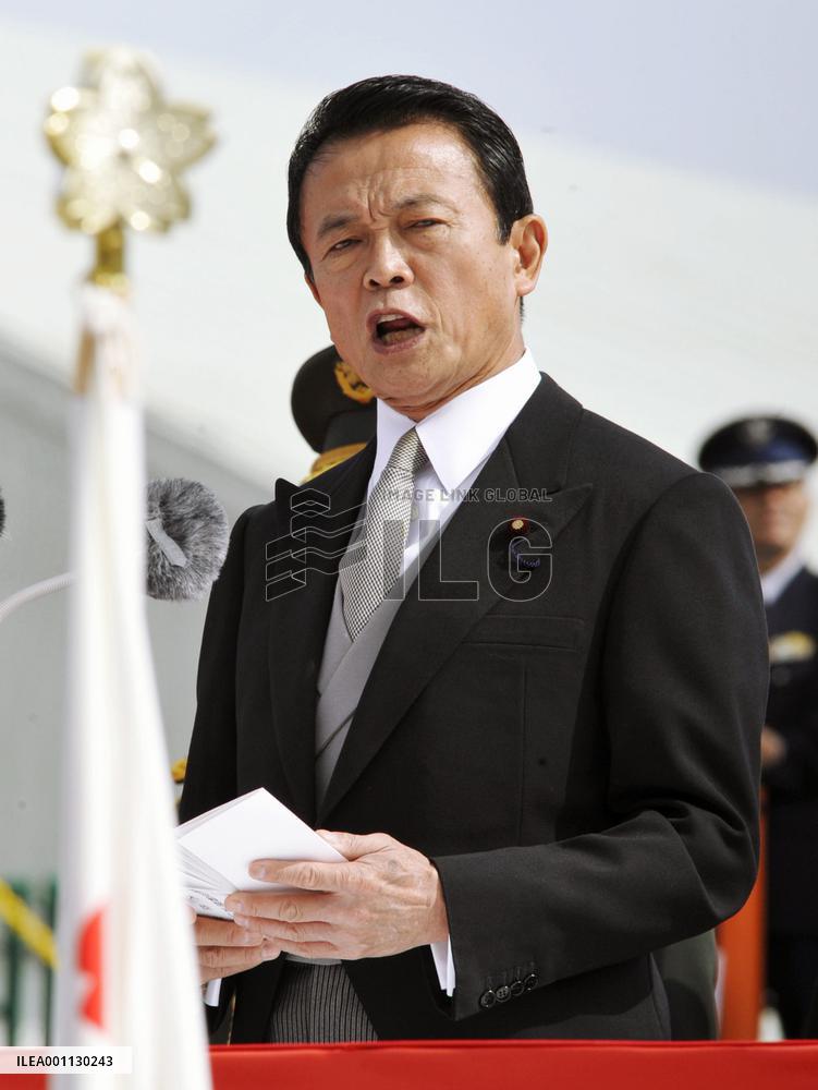 Aso at SDF review pledges to continue refueling mission