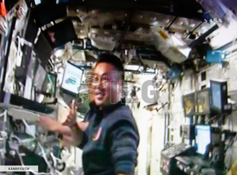 Astronauts install solar arrays on space station