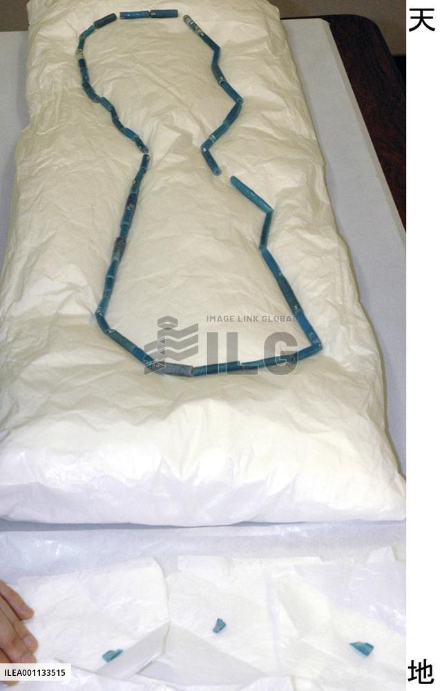 Museum curator breaks 2,200-year-old glass accessory